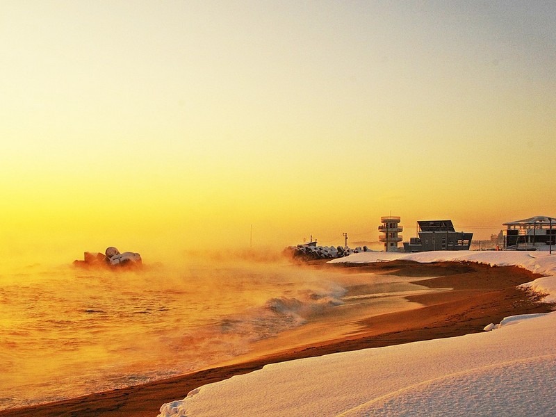 winter in Korea, snow on the beach at sunrise