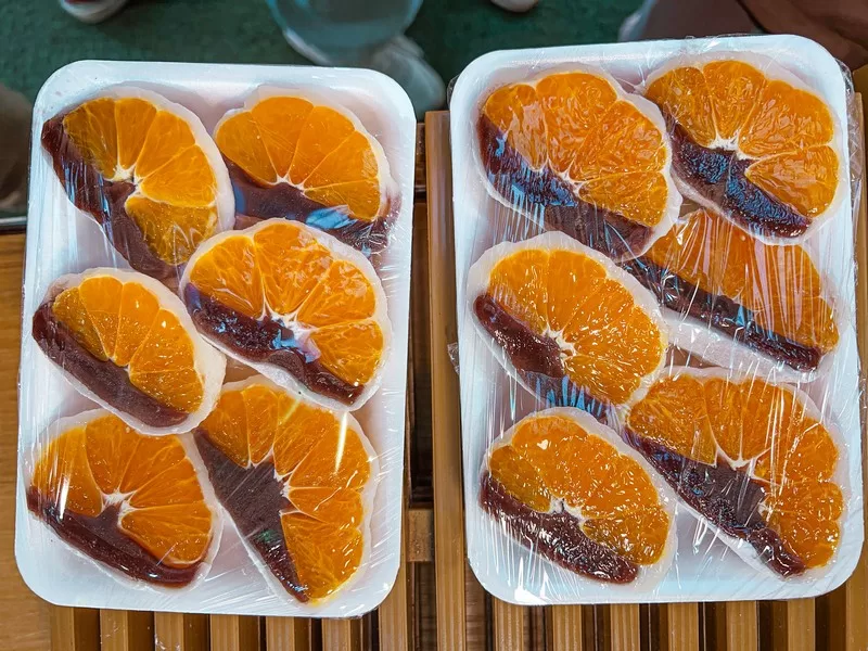 Seogwipo Maeil Olle Market (서귀포매일올레시장), Seogwipo-si, Jeju-do, Korea; Korean food, Tangerine Mochi (감귤모찌)